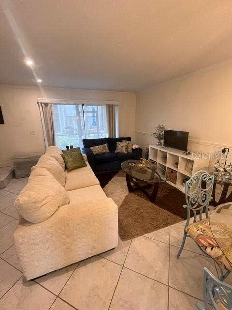 1614 Stickney Point Road, Unit 102 Sarasota, FL 34231 - Photo 8 of 34 a bed room with a bed and a couch