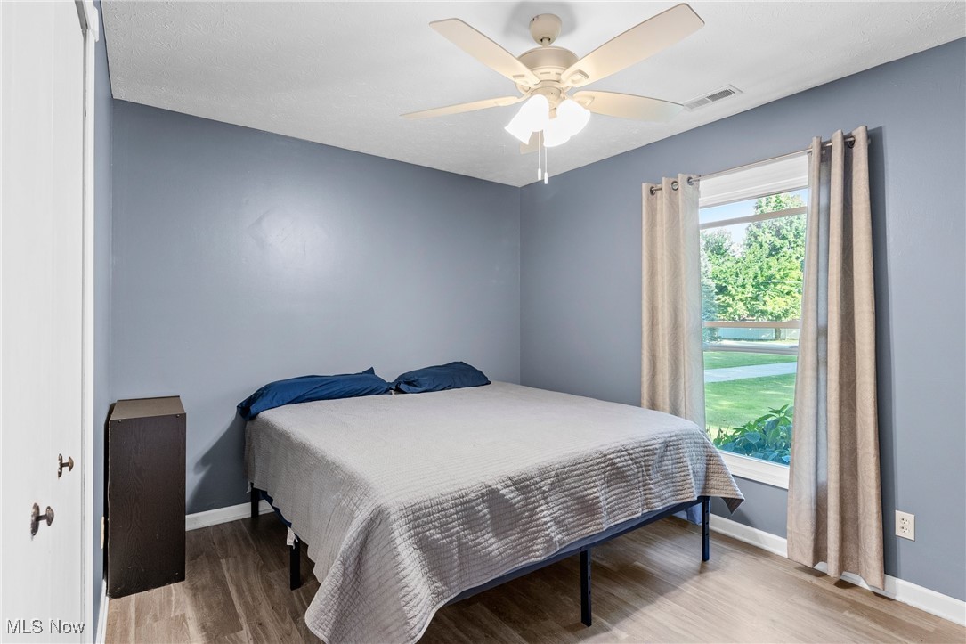 7944 Middle Ridge Road Madison, OH 44057 - Photo 23 of 31 Bedroom featuring light wood finished floors and ceiling fan