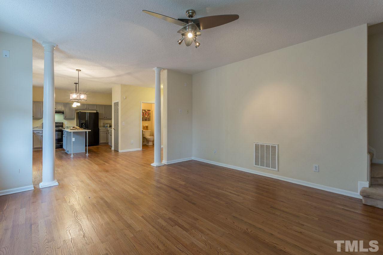 12516 Garden Tree Lane Raleigh, NC 27614 - Photo 12 of 25 wooden floor in an empty room with a window