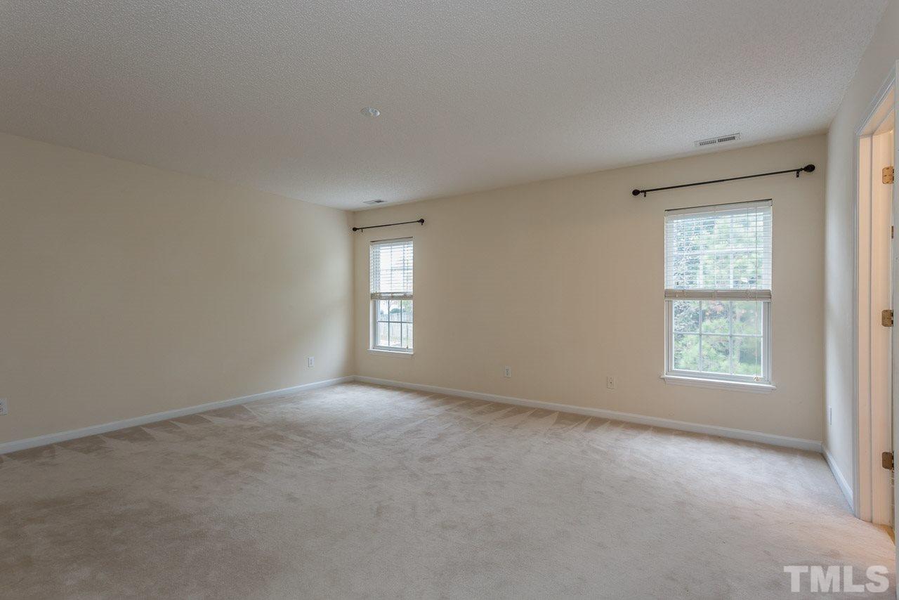 12516 Garden Tree Lane Raleigh, NC 27614 - Photo 15 of 25 an empty room with windows