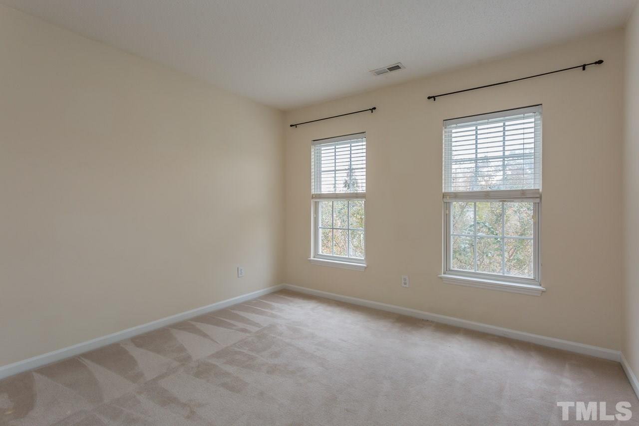 12516 Garden Tree Lane Raleigh, NC 27614 - Photo 18 of 25 an empty room with windows