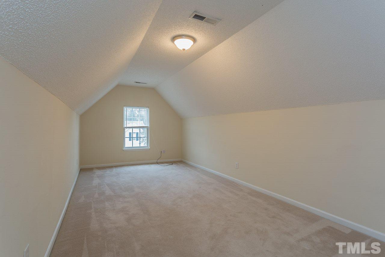 12516 Garden Tree Lane Raleigh, NC 27614 - Photo 19 of 25 an empty room with a empty space and windows