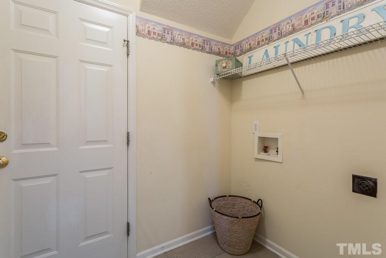 12516 Garden Tree Lane Raleigh, NC 27614 - Photo 23 of 25 a bathroom with a granite countertop toilet and a shower