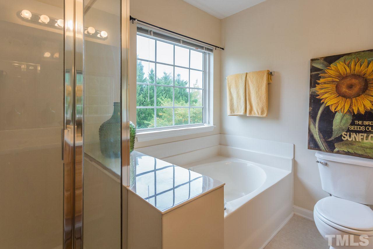 12516 Garden Tree Lane Raleigh, NC 27614 - Photo 5 of 25 a bathroom with a sink a toilet and a bathtub