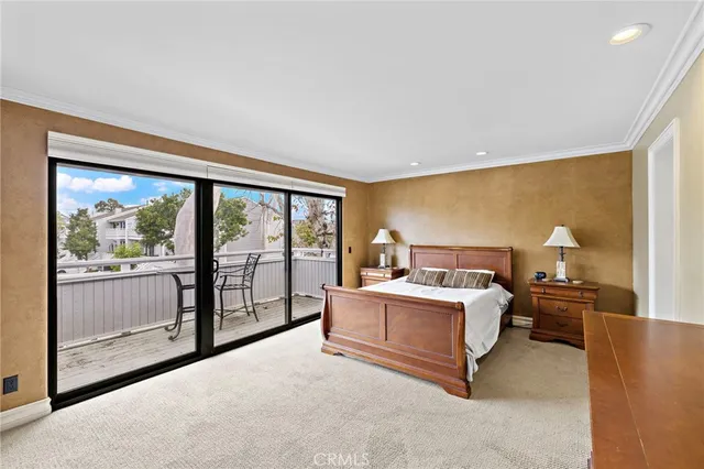 a bed room with a bed and a large window