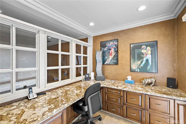 a view of cabinets a sink and a window