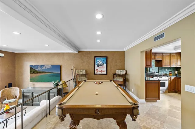 a room with furniture pool table and flat screen tv