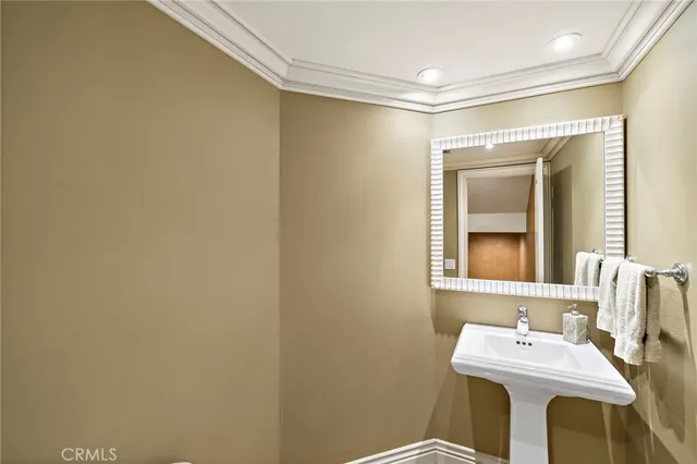 a bathroom with a sink mirror and a vanity