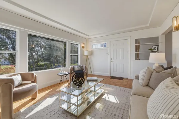 a living room with furniture and a large window