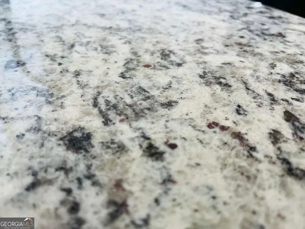 a close up of a white marble wall