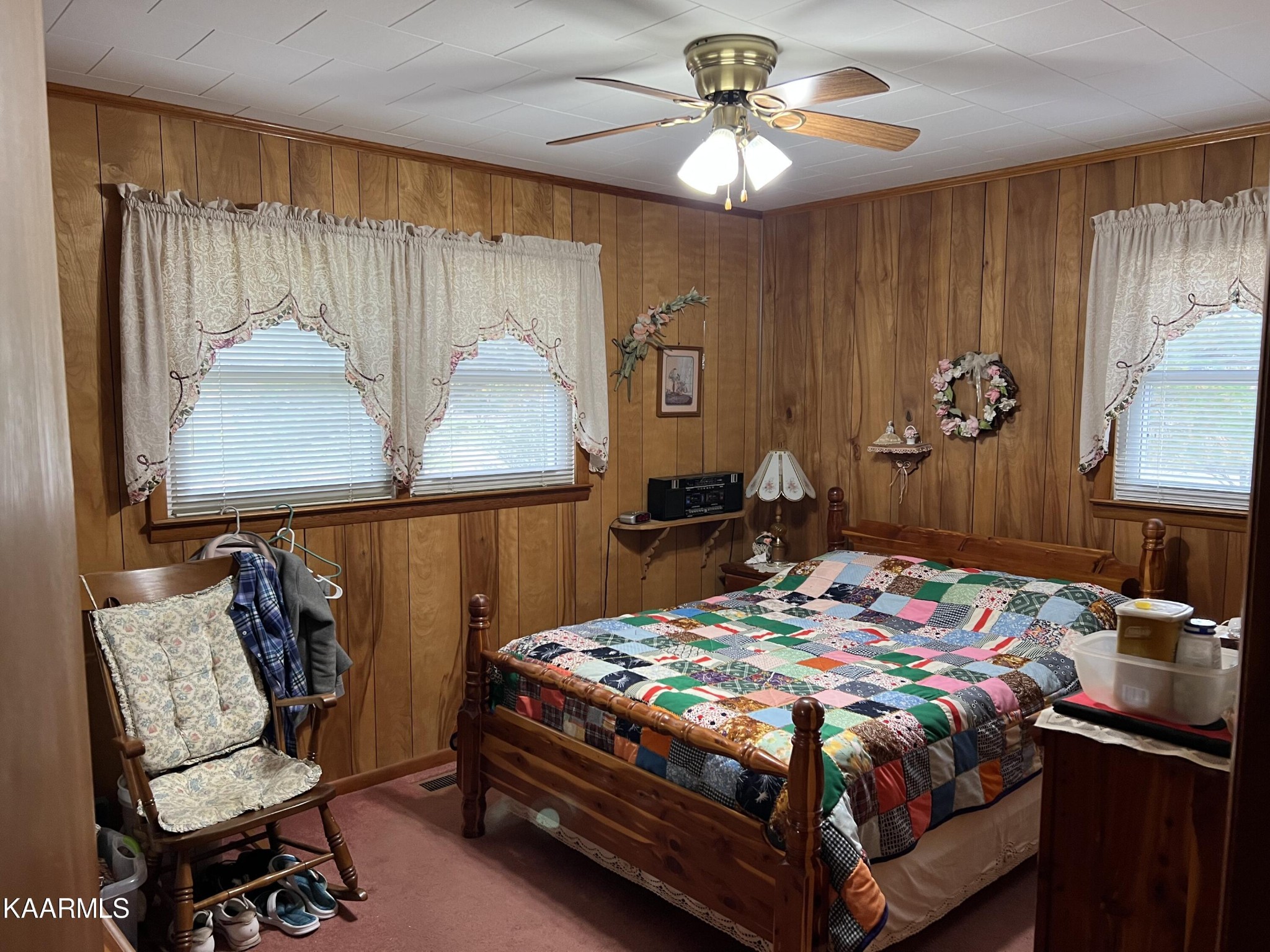 969 Unity Church Road Jamestown, TN 38556 - Photo 20 of 24 a bedroom with a bed and a chandelier