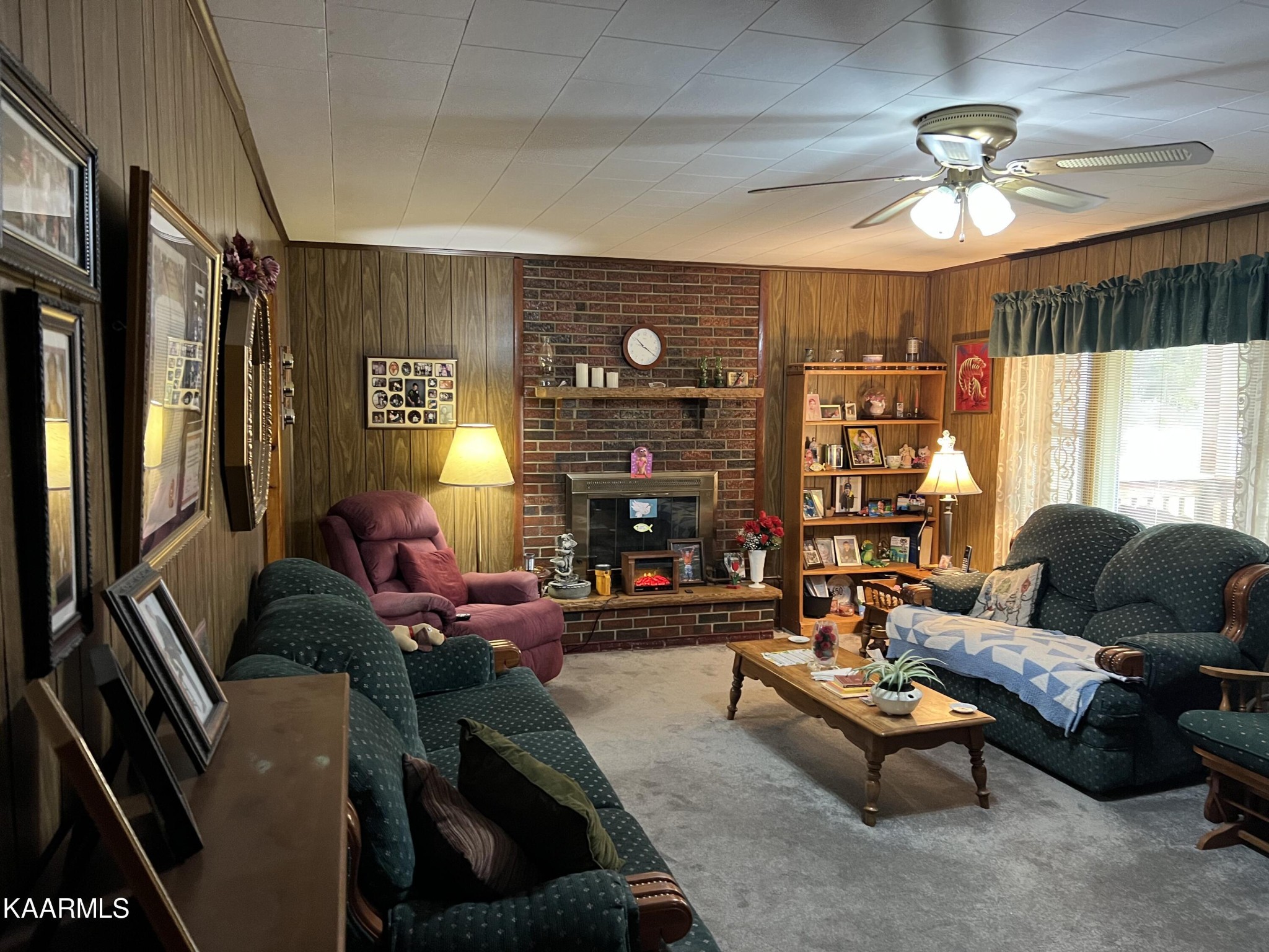 969 Unity Church Road Jamestown, TN 38556 - Photo 24 of 24 a living room with furniture a fireplace and a flat screen tv