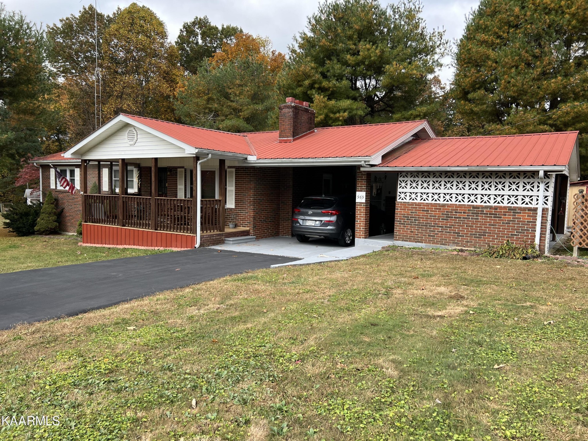 969 Unity Church Road Jamestown, TN 38556 - Photo 3 of 24 a front view of a house with a yard and garage