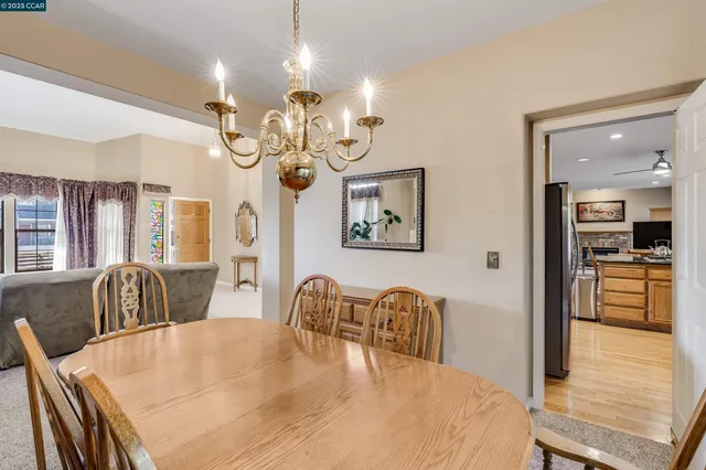 a kitchen with granite countertop a refrigerator and a stove