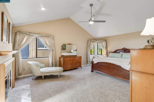 a bathroom with a tub a sink and a large mirror
