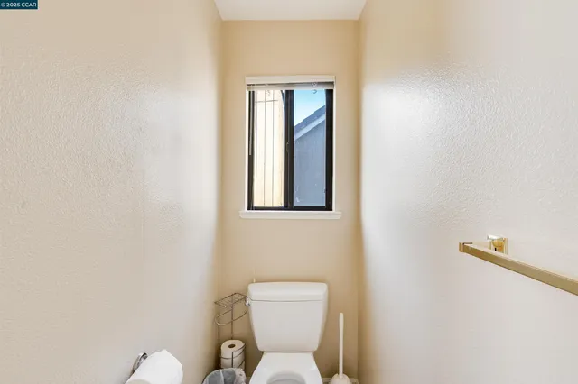 a bathroom with a shower a toilet and a shower