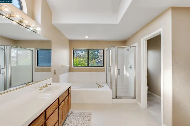 a bathroom with a toilet sink and shower