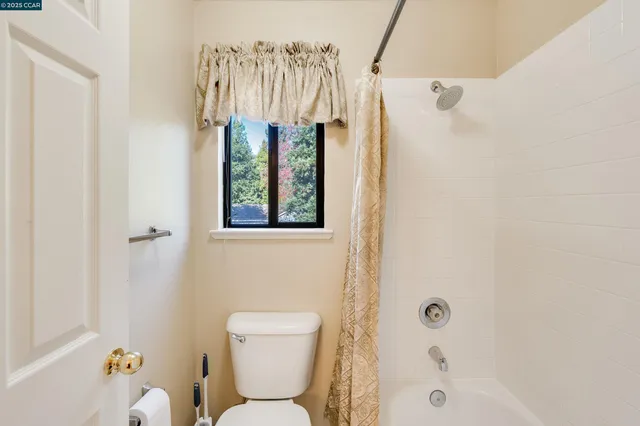 a view of a house with backyard sitting area and fire pit