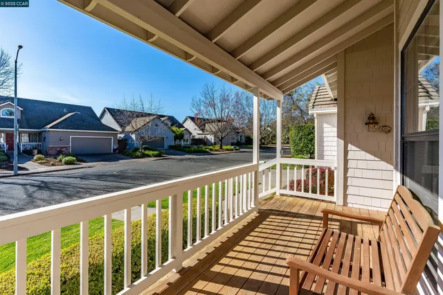 a balcony view with a seating space