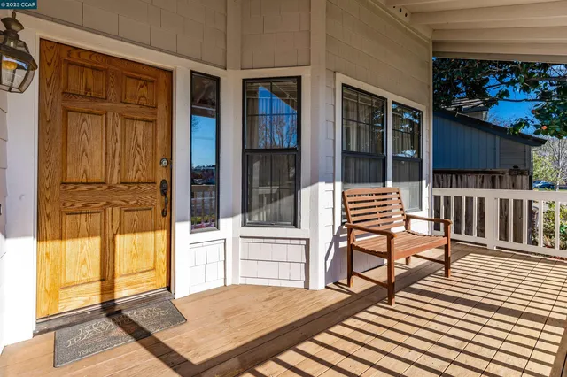 a view of a house with backyard and porch