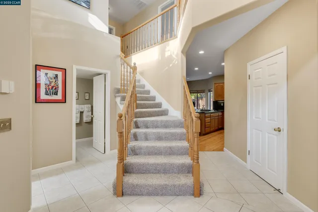 a living room with furniture and a painting