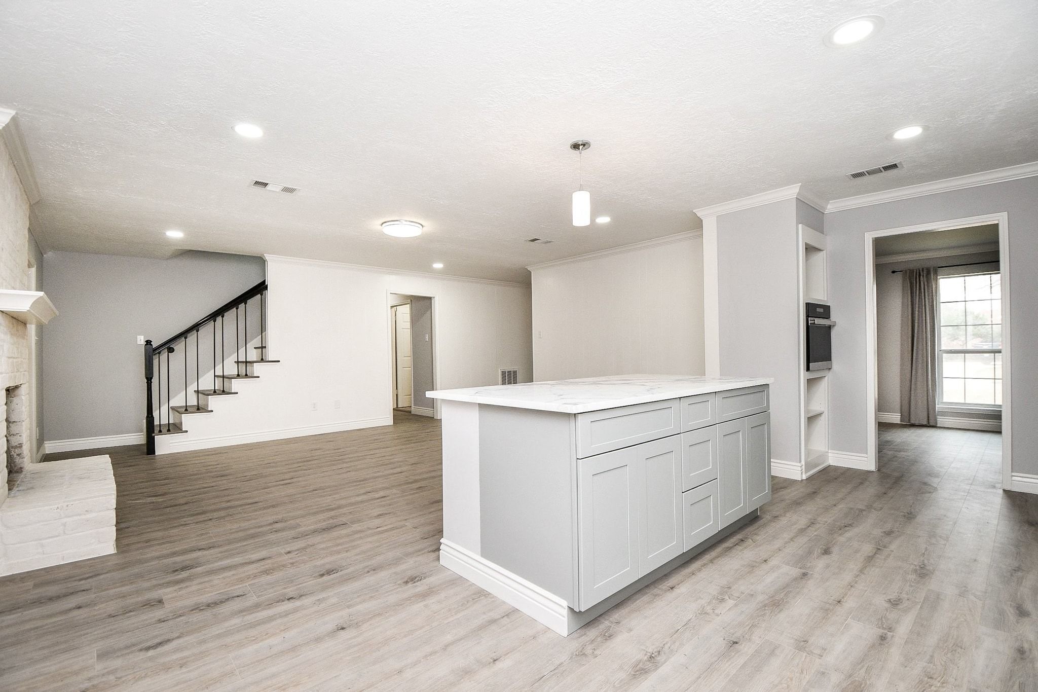 14011 Wickersham Lane Houston, TX 77077 - Photo 11 of 38 Freshly remodeled kitchen complete with new appliances and a large central island opening to family room.