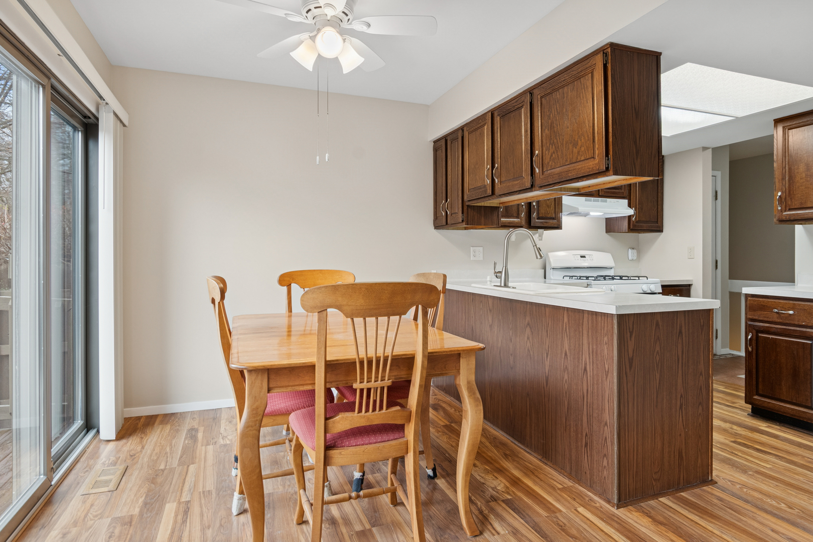 101 Aberdeen Court Geneva, IL 60134 - Photo 7 of 23 a kitchen with stainless steel appliances granite countertop a table chairs sink and cabinets