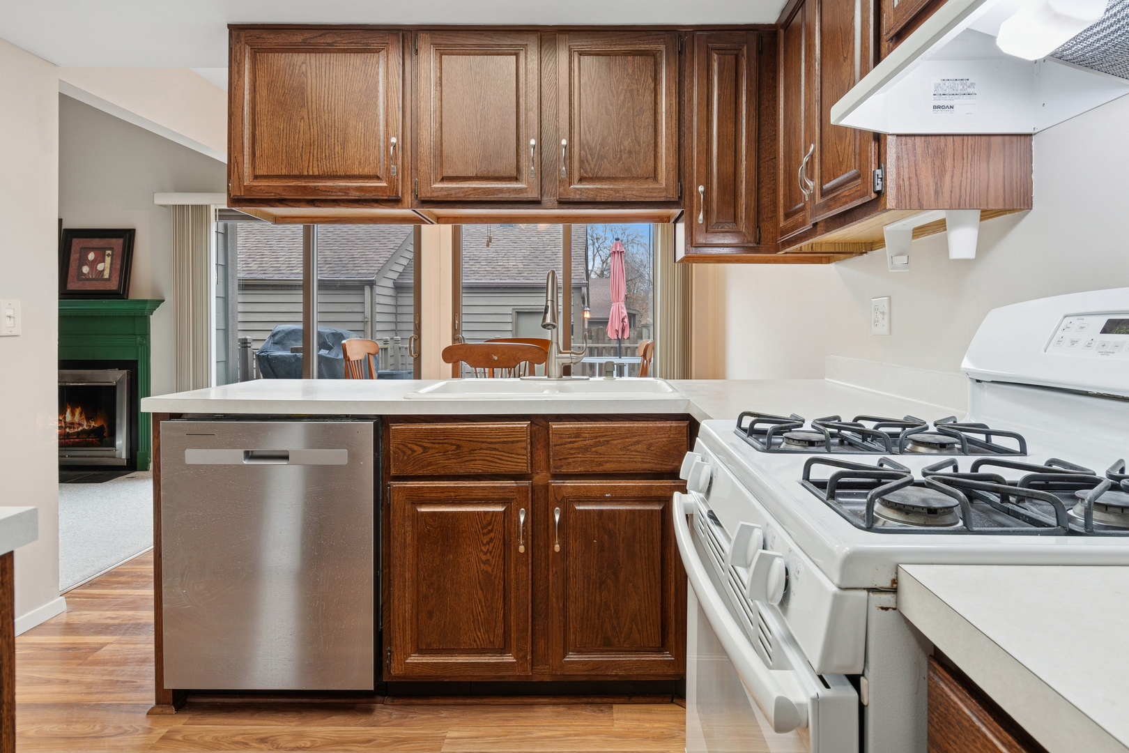 101 Aberdeen Court Geneva, IL 60134 - Photo 9 of 23 a kitchen with stainless steel appliances granite countertop a stove a sink and a refrigerator