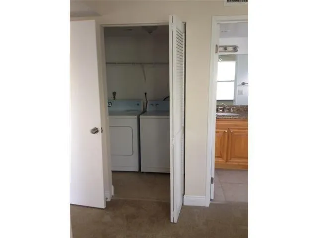 a view of a lake with furniture