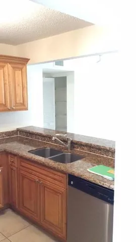 a kitchen with a sink and a window