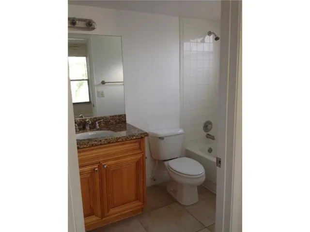 a bathroom with a bathtub sink and toilet