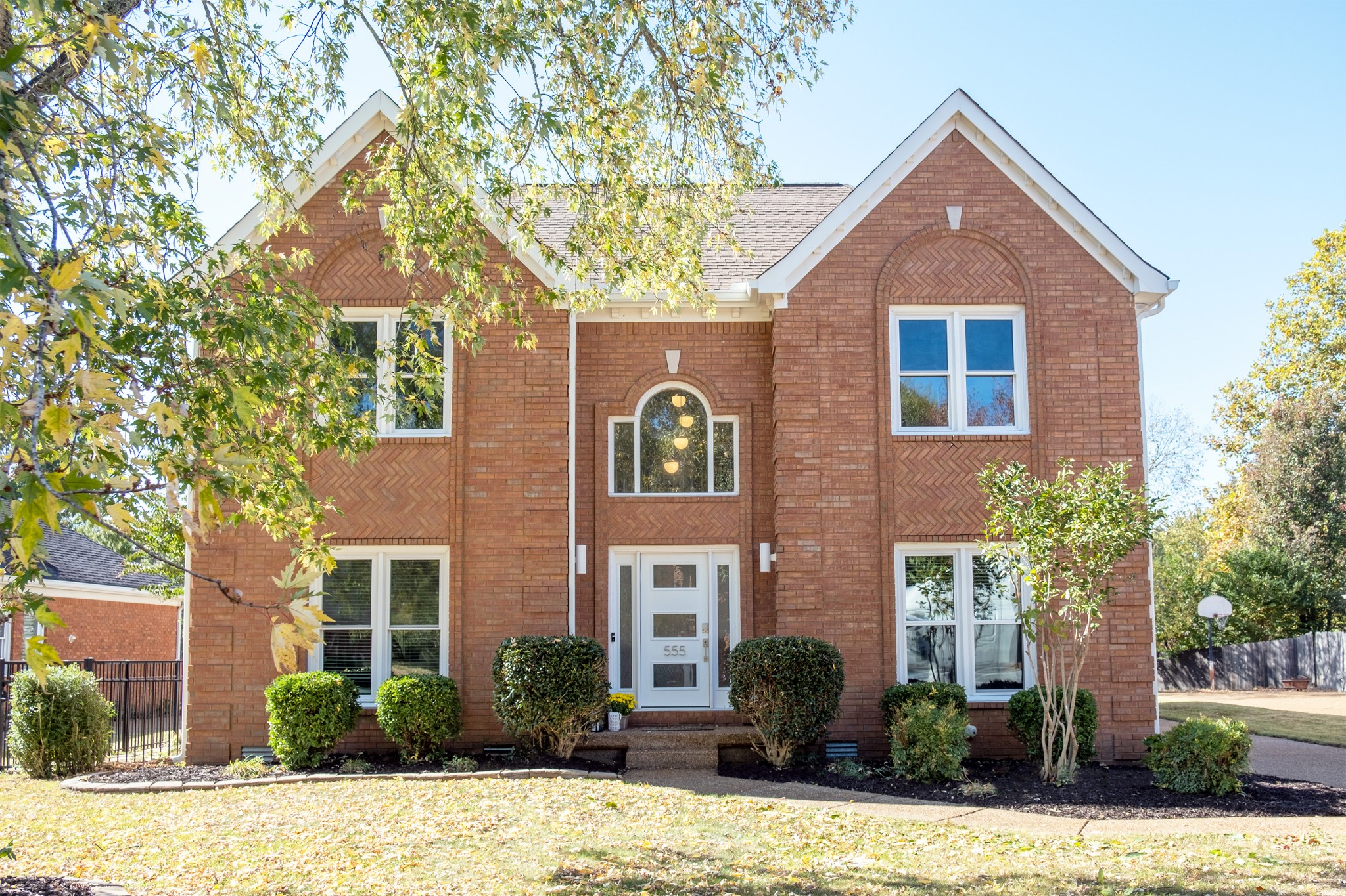 a front view of a house with a yard