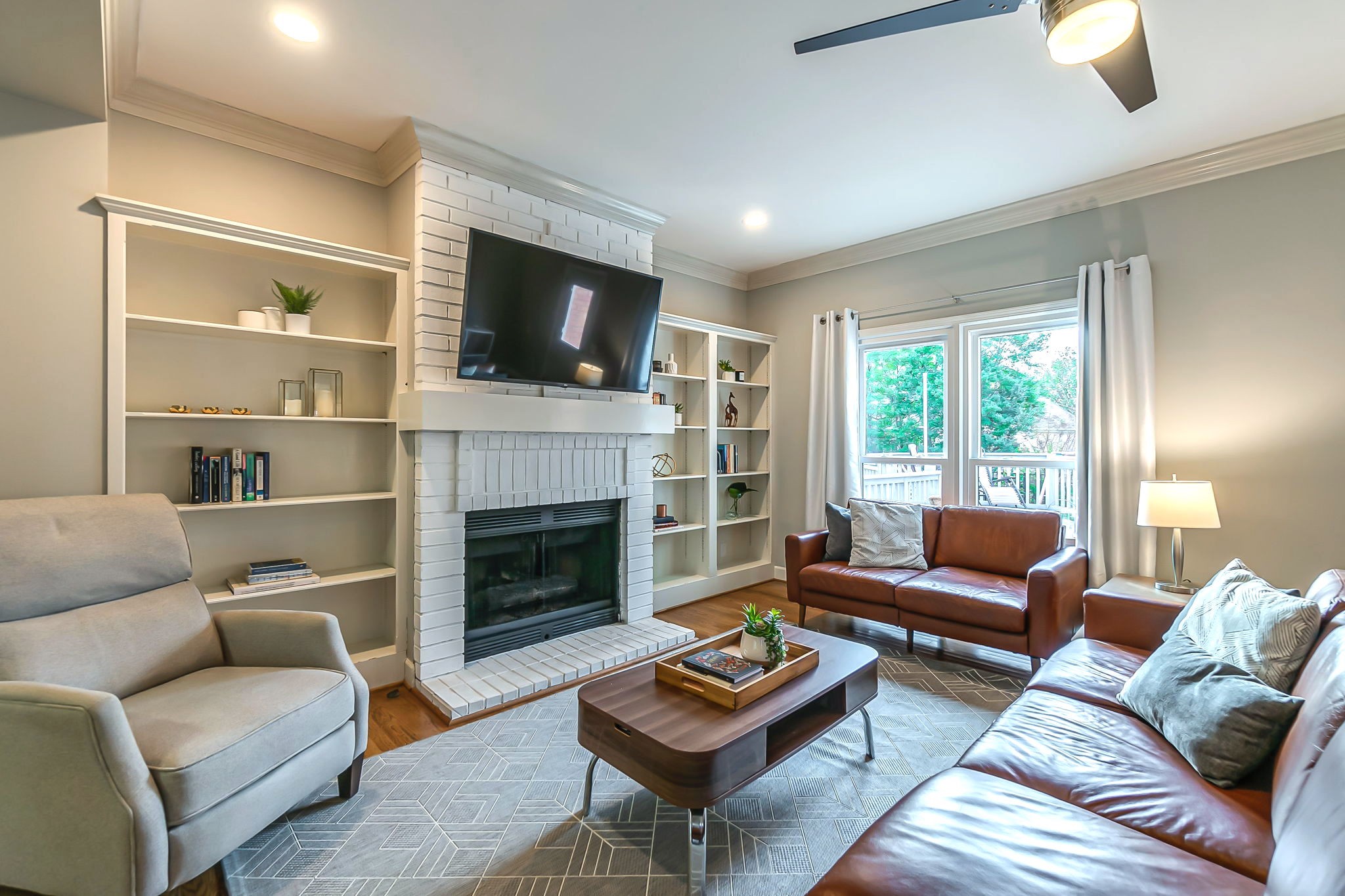 555 Ridgestone Drive Franklin, TN 37064 - Photo 11 of 46 a living room with furniture fireplace and flat screen tv