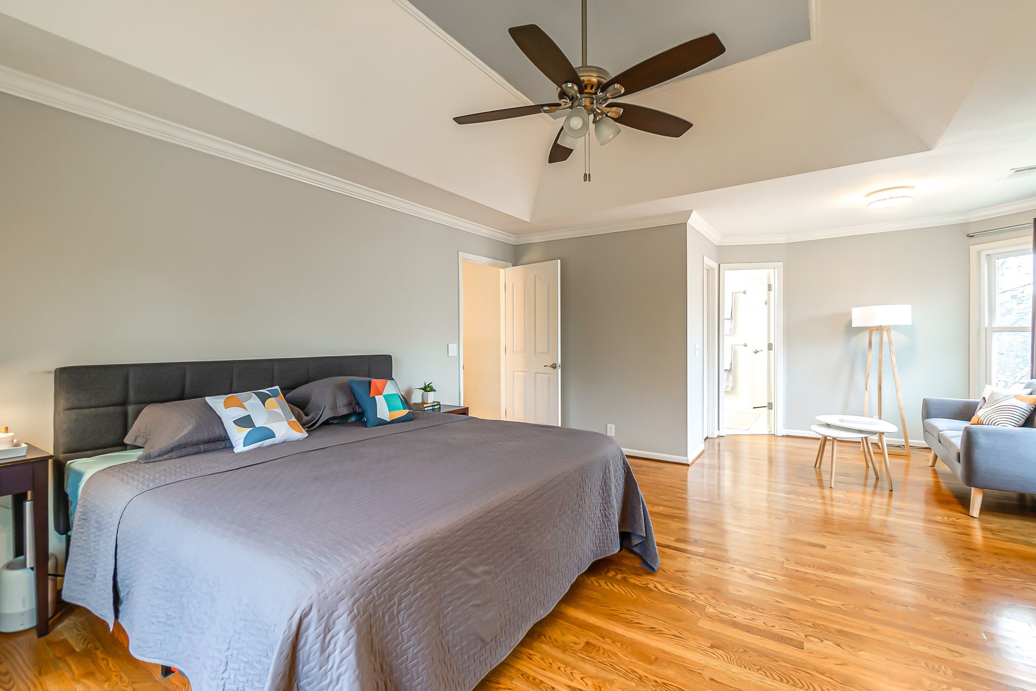 555 Ridgestone Drive Franklin, TN 37064 - Photo 21 of 46 a bedroom with a large bed a chandelier and a bookshelf