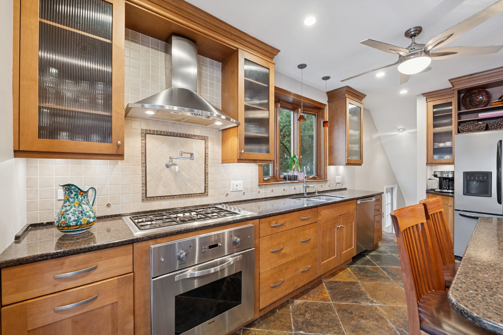 369 Addison Road Riverside, IL 60546 - Photo 7 of 23 a kitchen with stainless steel appliances granite countertop a stove a sink and a cabinets