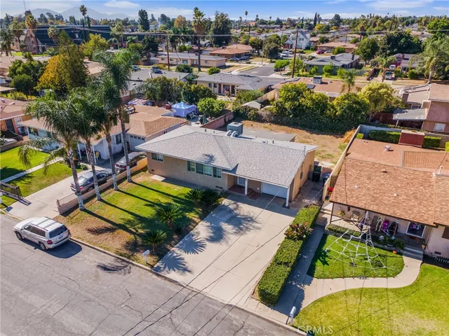 an aerial view of a house with a swimming pool yard and outdoor seating