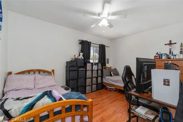 a bedroom with furniture and a window