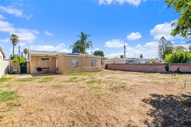 a view of a house with a snow and yard