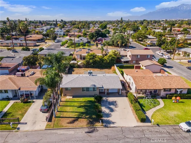 an aerial view of a house with a garden