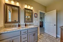 1309 Ridge Pointe Way Blairsville, GA 30512 - Photo 16 of 73 a bathroom with double vanity sinks and a mirror
