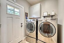 1309 Ridge Pointe Way Blairsville, GA 30512 - Photo 19 of 73 a view of a hallway with washer and dryer