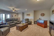 1309 Ridge Pointe Way Blairsville, GA 30512 - Photo 22 of 73 a living room with furniture a rug and a chandelier
