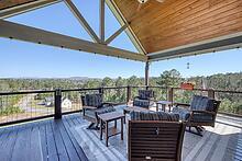 1309 Ridge Pointe Way Blairsville, GA 30512 - Photo 29 of 73 a view of a balcony with furniture and wooden floor