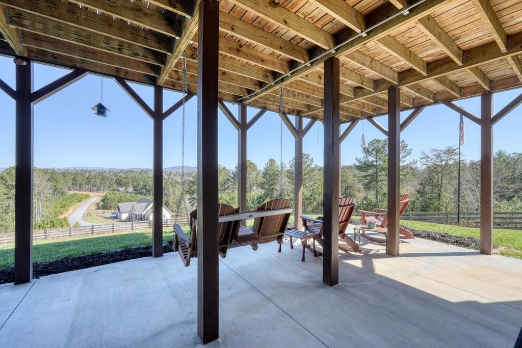 1309 Ridge Pointe Way Blairsville, GA 30512 - Photo 50 of 73 a view of a porch with furniture and wooden deck