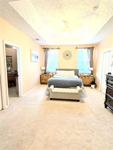 a bedroom with bed and window