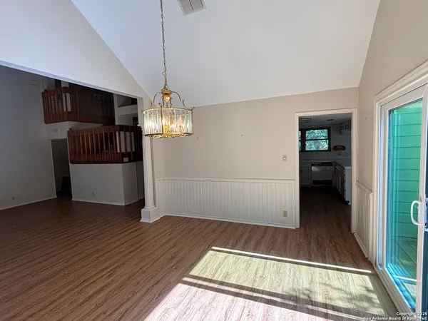 a view of a livingroom with wooden floor