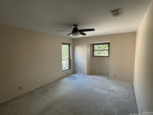 a view of an empty room with a window