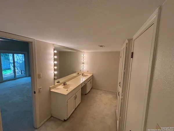 a room with furniture and flat screen tv