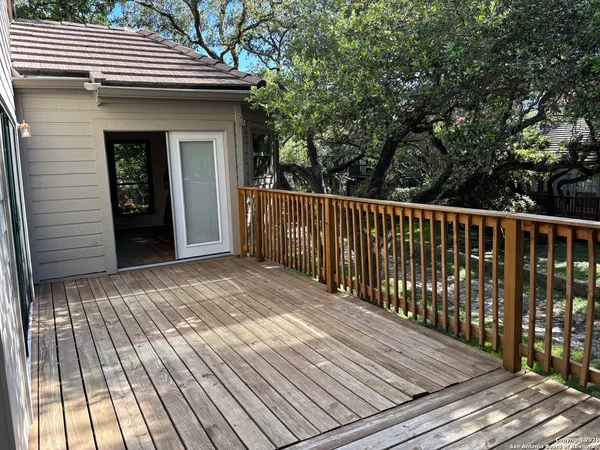 a view of balcony with wooden floor