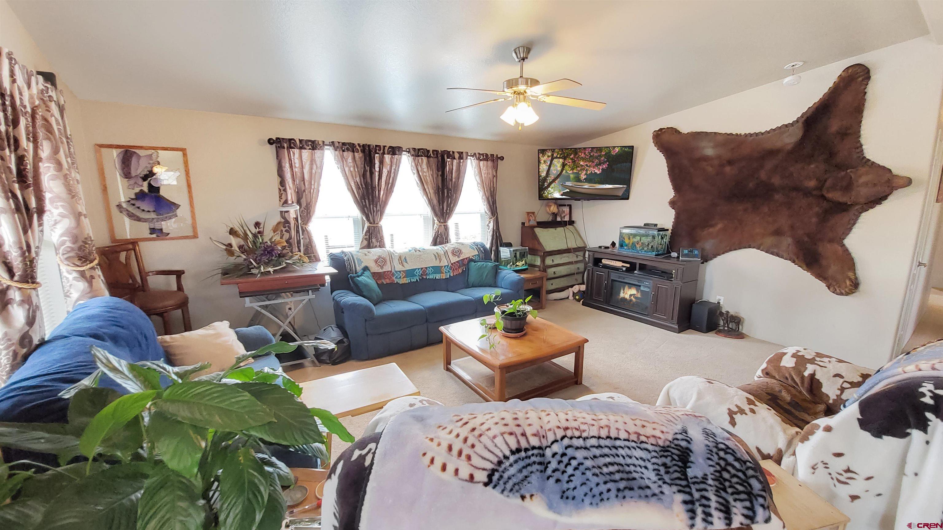 13635 County Road 23 Cortez, CO 81321 - Photo 11 of 30 a bedroom with furniture and a large window